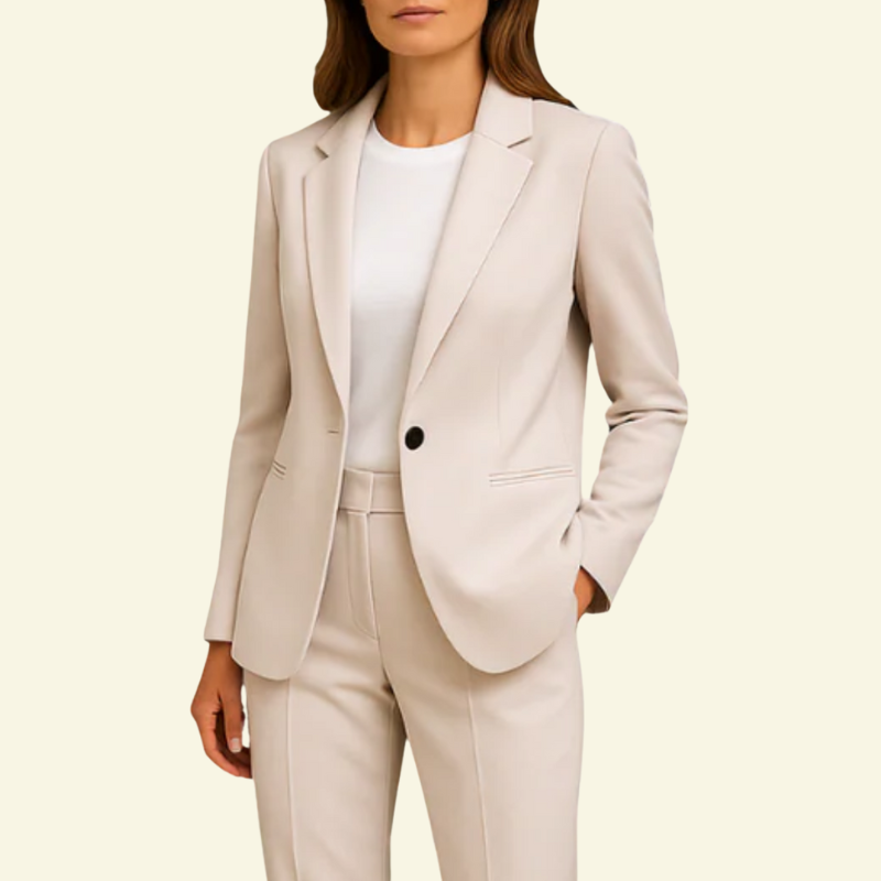 Woman wearing Creme suit set with white undershirt