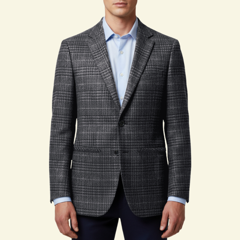 Model w ciemnoszarej marynarce w subtelną kratę, ujęcie od przodu.