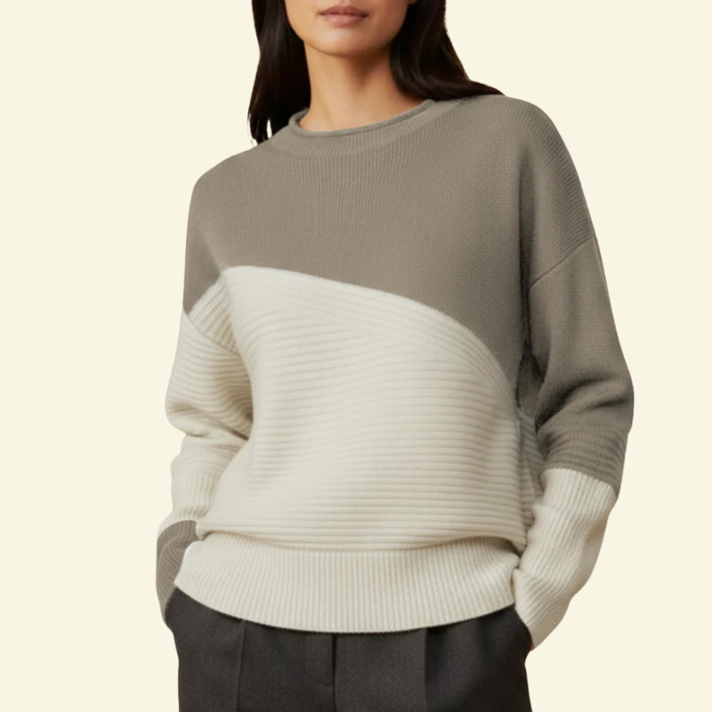 Modelka w swetrze w odcieniu beżowo-szarym; wyraźne kontrastowe przejście do kremowego panelu.