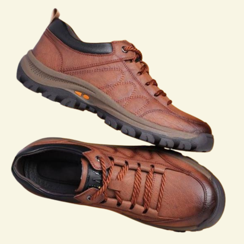 Brązowe sneakersy męskie o casualowej formie, wykonane ze skóry ekologicznej, zaprezentowane w ujęciu produktowym na jasnym tle.