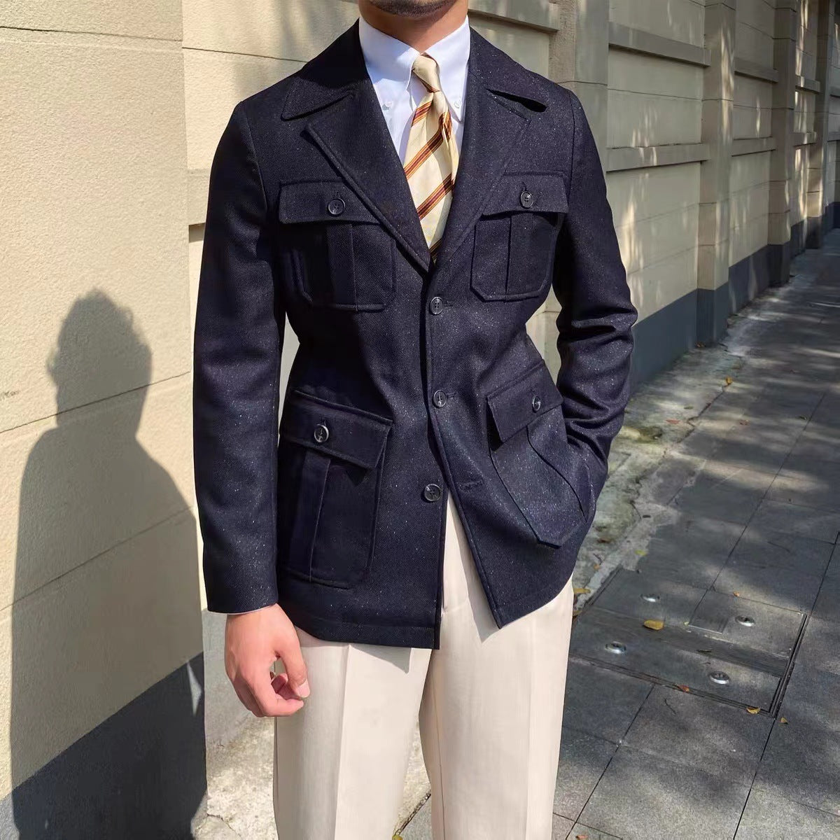 backside Photo of male model wearing Navy blue men's jacket