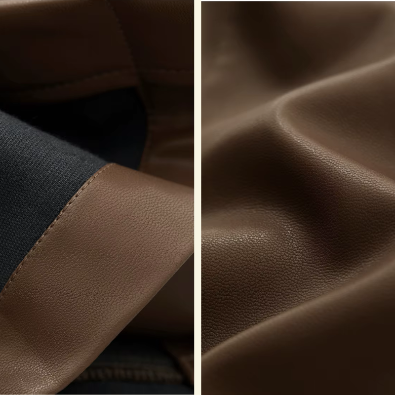 Zbliżenie na fakturę materiału i przeszycia spodni ze skóry ekologicznej, brązowo-czarny kontrastowy detal — Lubomirske