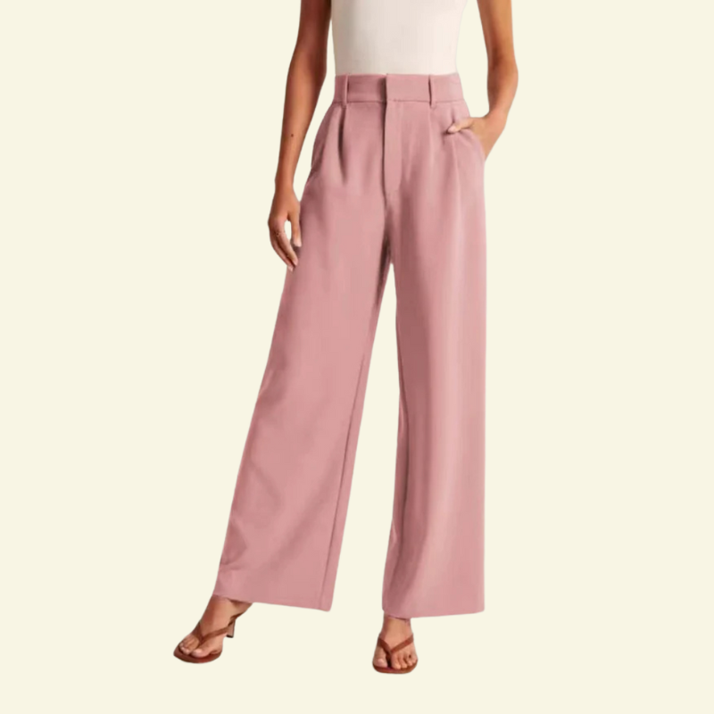 Różowe spodnie z szerokimi nogawkami i podkreśloną talią, prezentowane na modelce, styl ponadczasowej elegancji — Lubomirske