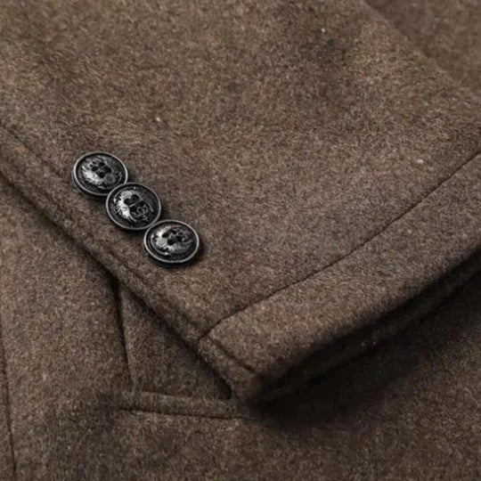 Detail photo of brown men's coat sleeve