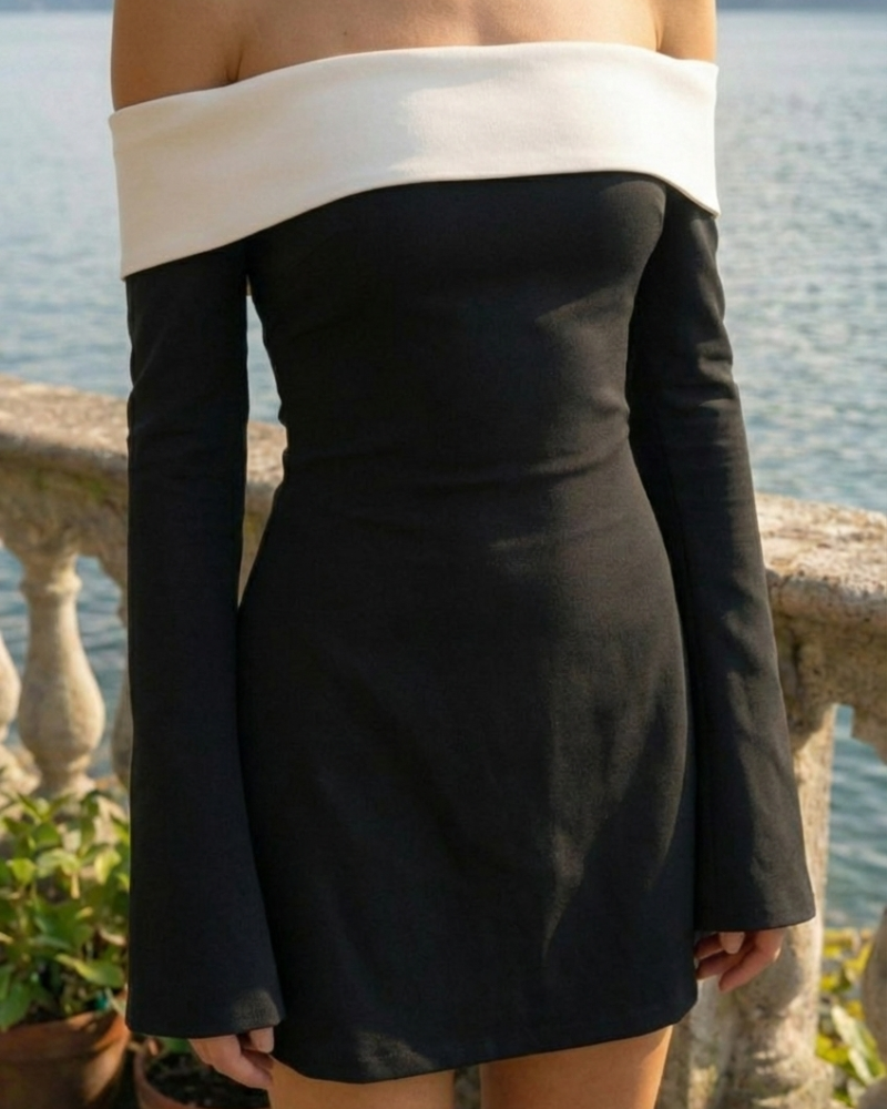 detal dekoltu hiszpanka i dopasowanej talii czarnej sukienki